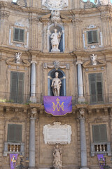 Obraz premium Palermo, Sicily. Holy week in Palermo where building are adorned with purple flags and Roman soldiers re-enact the events of Easter.