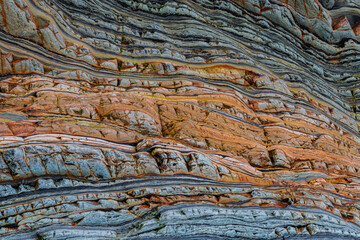 Spain, Barrika. Contorted rock layers on beach.