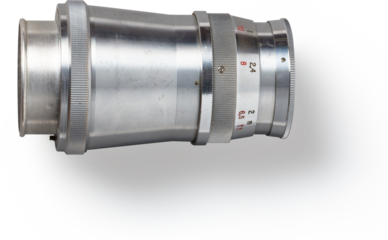 A vintage camera lens showcasing its metallic design and aperture settings, used for photography.