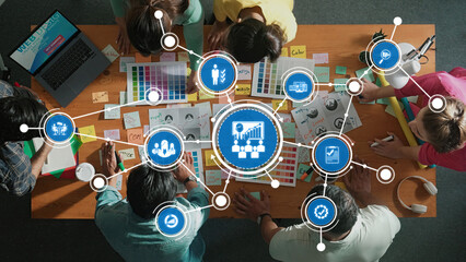 A dynamic workspace showing a diverse team engaged in creative management strategies using colorful...