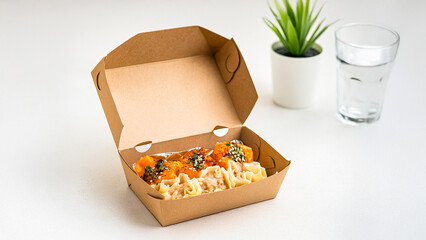 Closeup of authentic Asian dim sum: traditional siu mai and innovative pumpkin dumplings, neatly packed in an eco-friendly, biodegradable takeout container, ideal for online food delivery visuals.