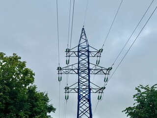 Power line on a blue sky background. High quality photo