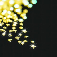 Gold Particles Sparkling on Dark Background