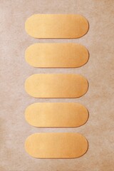 Gold Oval Labels on Kraft Paper Background