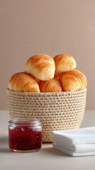 Golden Croissants in Wicker Basket with Jam and Napkins