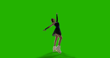 Figure skating woman on green screen background.