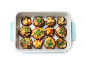 Tasty stuffed mushrooms in baking dish isolated on white, top view