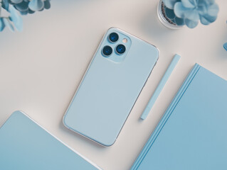 Top View of Blue Smartphone and Desk Accessories
