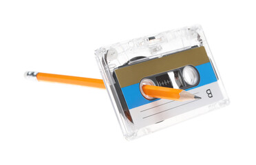 Rewinding audio cassette with pencil isolated on white