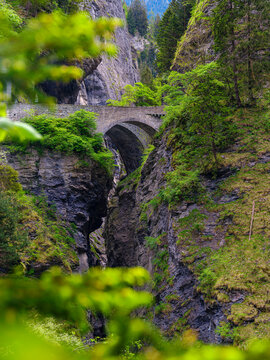 The old bridge crossing the gorge. The Viamala Gorge in the nature park Beverin, carved out by river Hinterrhein and an attraction of Graubunden, Switzerland.
