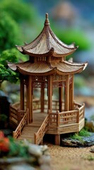 Intricate miniature pagoda, wood-crafted, tiered roof, detailed latticework, small bridge leading to it, nestled in a miniature garden setting