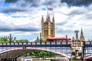 Red bus, houses of Parliament, Thames River, Lambeth Bridge, Westminster, London, England. Built in...