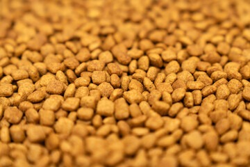 Food for animals background. Dry cat and dog food texture, pattern. Pet meal background close up....