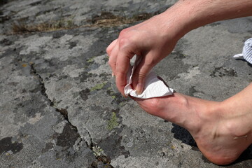Small foot injury. Bloody paper. Close up and isolated.