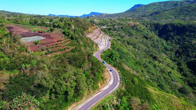 Aerial drone shot of a road in the moutains in Indonesia, between Wologai and Kelimutu, in Flores island