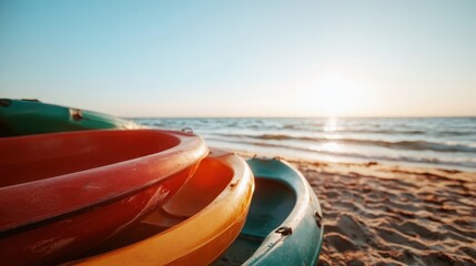 Fototapeta premium A vibrant array of colorful kayaks stacked on the sand, set against a beautiful beach and tranquil ocean, evoking a sense of adventure and relaxation by the seaside.