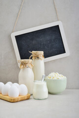 Various dairy products and eggs with framed chalk board