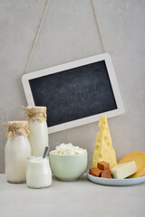 Various dairy products with framed chalk board