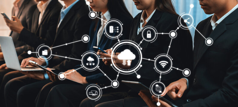 Asian job applicant in identical formal wear sitting in waiting room for job interview. Office worker or business people working in cramped room together using laptop and phone. Trailblazing Amity