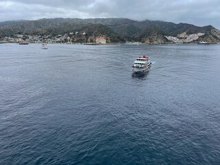 Catalina Island, California, June 4, 2025: Catalina Island at Avalon Harbor looking at Cruise Tender Boats Carrying Passengers to the Port to explore the Island.