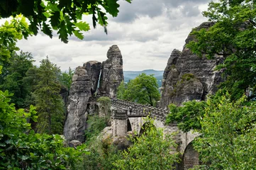 Printed kitchen splashbacks Bastei Bridge in the green trees, Saxon Switzerland, Saxony, Germany, Europe. Stone bridge, mesa in the background. The Bastion Bridge in Saxony, Switzerland National Park.