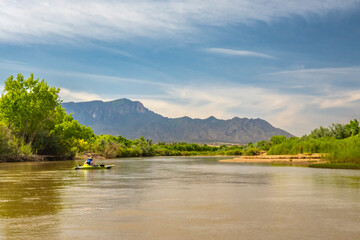 USA, New Mexico, Rio Grande River. Kayaker on river.