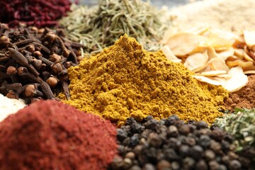 Many different spices as background, closeup view
