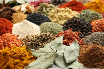 Many different spices as background, closeup view