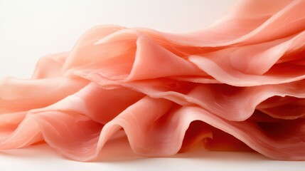 Obraz premium Elegant and enticing, this image showcases finely sliced prosciutto layered gracefully, emphasizing its smooth texture and pale color, a delight for gourmet cooking enthusiasts.