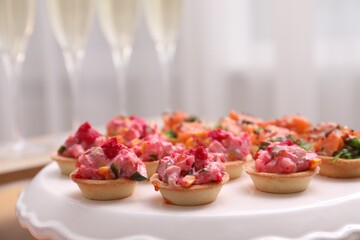 Buffet menu. Tasty stuffed tartlets on stand, closeup. Space for text