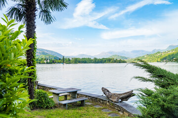 Spring view of Lake Lugano in the town of Caslano in the Swiss mountains