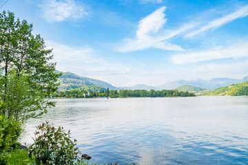 Spring view of Lake Lugano in the town of Caslano in the Swiss mountains