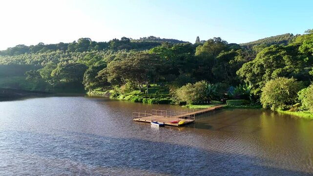 Aerial view showing the Chesumot Dam in Kericho, Kenya, nestled among green hills and dense trees