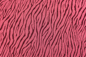 Texture of colored paper. Decorative sheet of cardboard with a zebra pattern. Pink glitter background