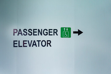 Sign and arrow direction for people and ADA access on a Puget Sound ferry, Seattle, Washington State, USA.