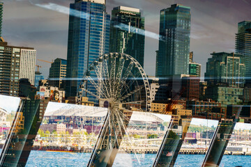 Window reflections from the Bainbridge Ferry of the Seattle skyline, Washington State, USA.