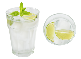Closeup cocktail drink gin tonic or cold lemonade drink garnished with line slice, top view,  side view isolated clipping path on white.