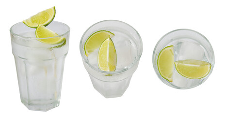 Closeup cocktail drink gin tonic or cold lemonade drink garnished with line slice, top view,  side...