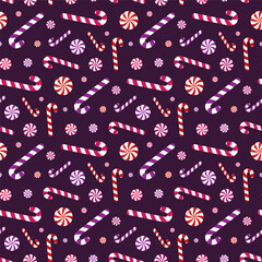 Small different candy canes and lollipops isolated on purple violet background. Cute seamless pattern. Vector simple flat graphic illustration. Texture.