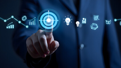 A hand interacts with a digital interface showcasing target goals, innovative ideas, and data analysis, representing strategic planning and business success.