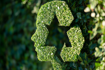 Aerial view Closeup headshot outdoor portrait Green recycle symbol icon sign with professional environment background to represent recycling or sorting of waste at office and for working people 