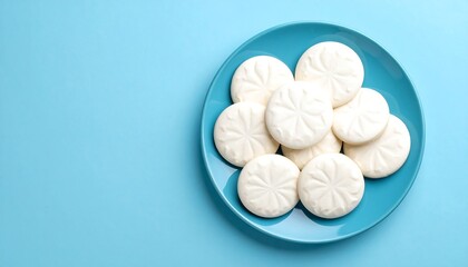 Obraz premium Snowdrop Cookies on Blue Plate.