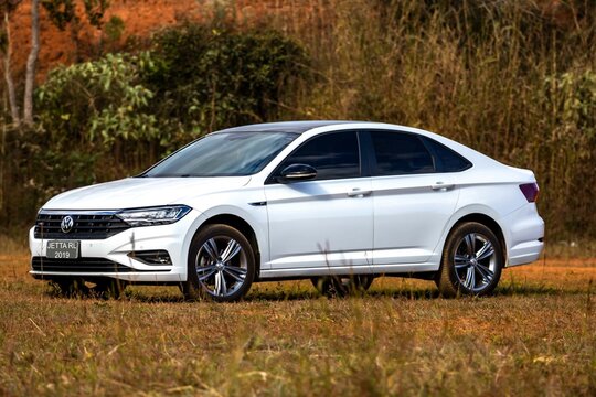 Brazil, June 19, 2025. White Volkswagen Jetta R Line 2019 with sunroof seen from the side in closeup in selective focus
