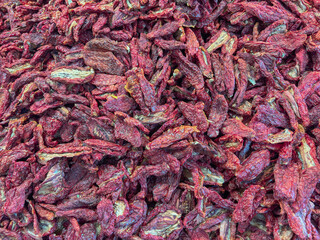 A close up, full frame view of a large pile of sun dried tomatoes, concept of italian cuisine,...