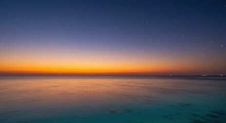 Obraz premium Ocean landscape with colorful twilight sky at dusk
