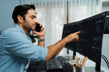 Smart IT developer manager calling to coworker solving problem in software coding system on pc...