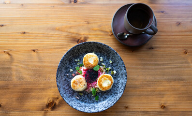 Top view of cheese pancakes on a plate.