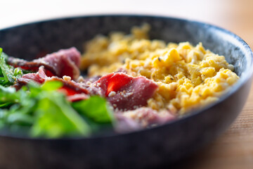 Omelette and green salad for breakfast.