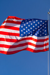 Obraz premium US flag on a flagpole.