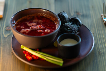 Ukrainian borscht with black buns.